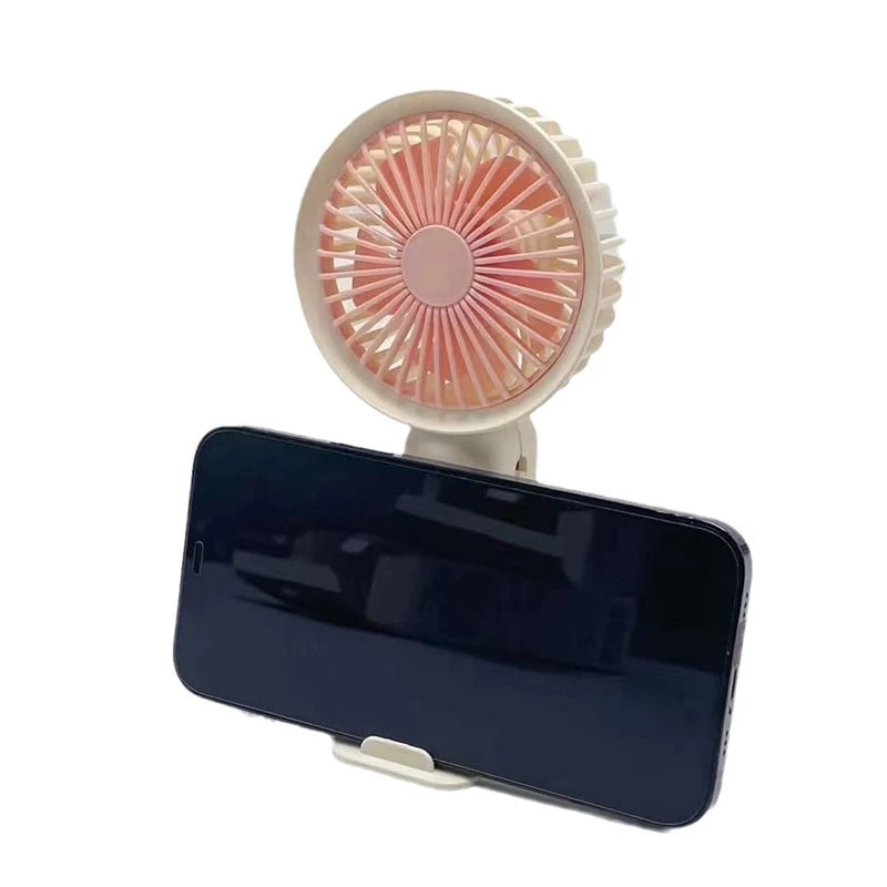 Portable silent charging fan with a phone holder, suitable for carrying or using on a desktop.