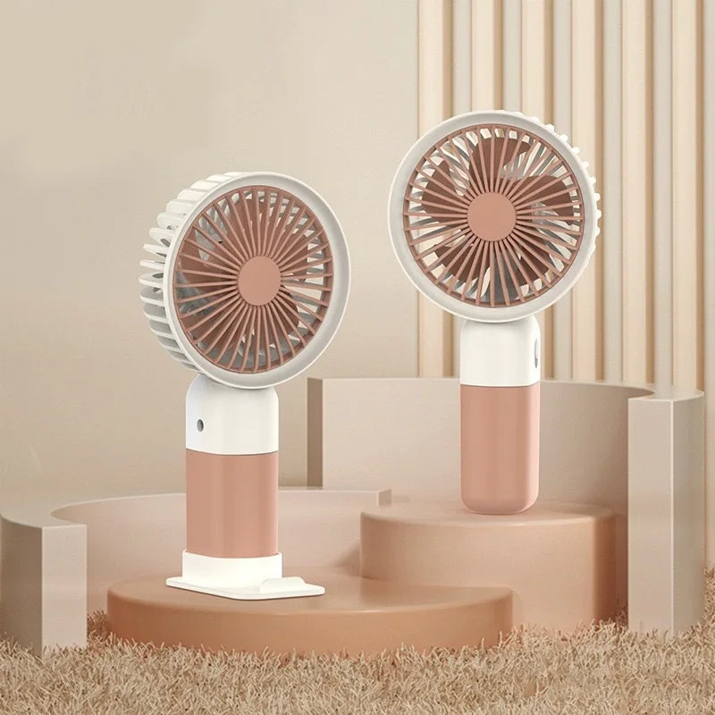 Portable silent charging fan with a phone holder, suitable for carrying or using on a desktop.